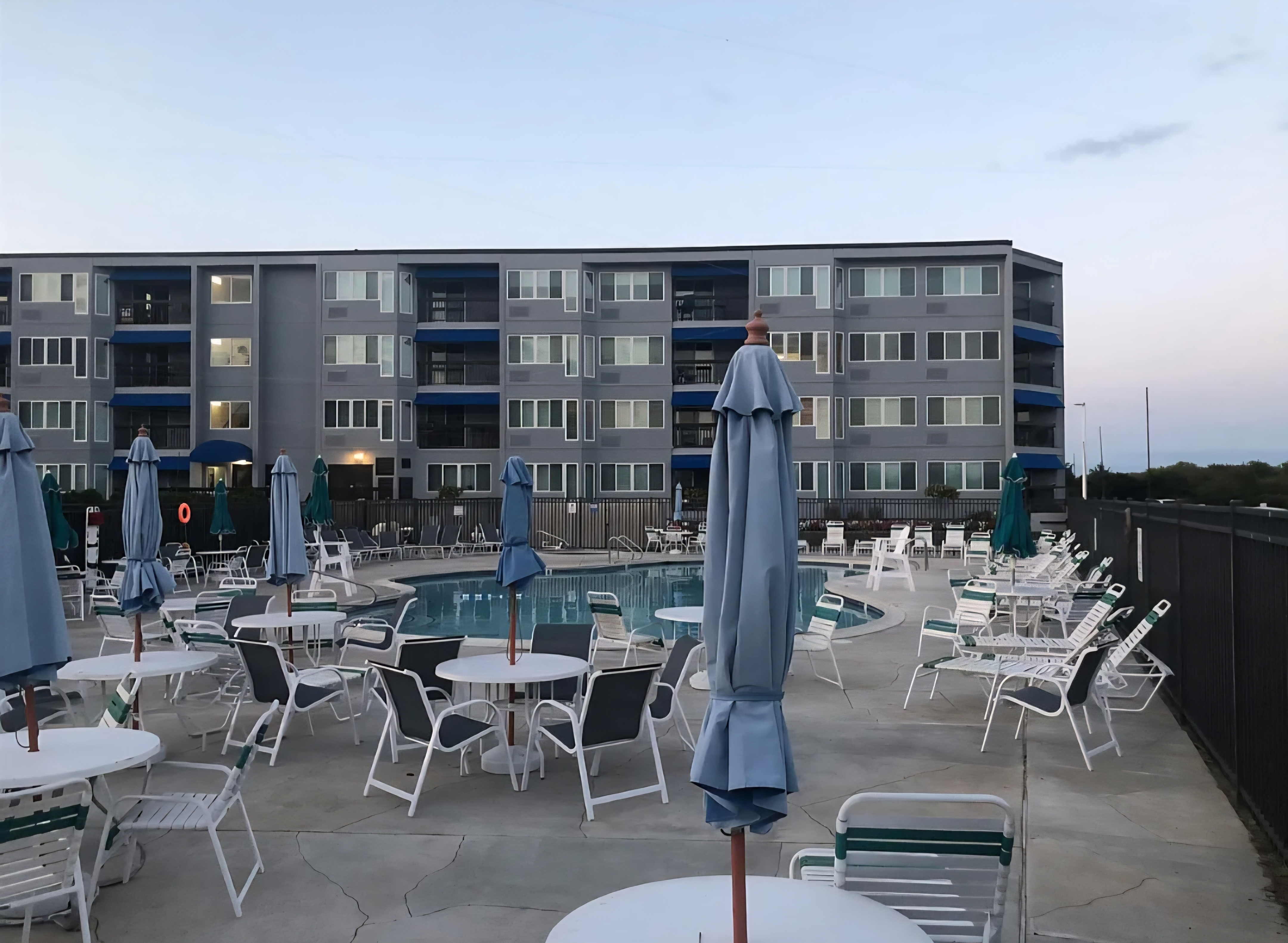 Resort-style pool deck with ample seating and modern surroundings