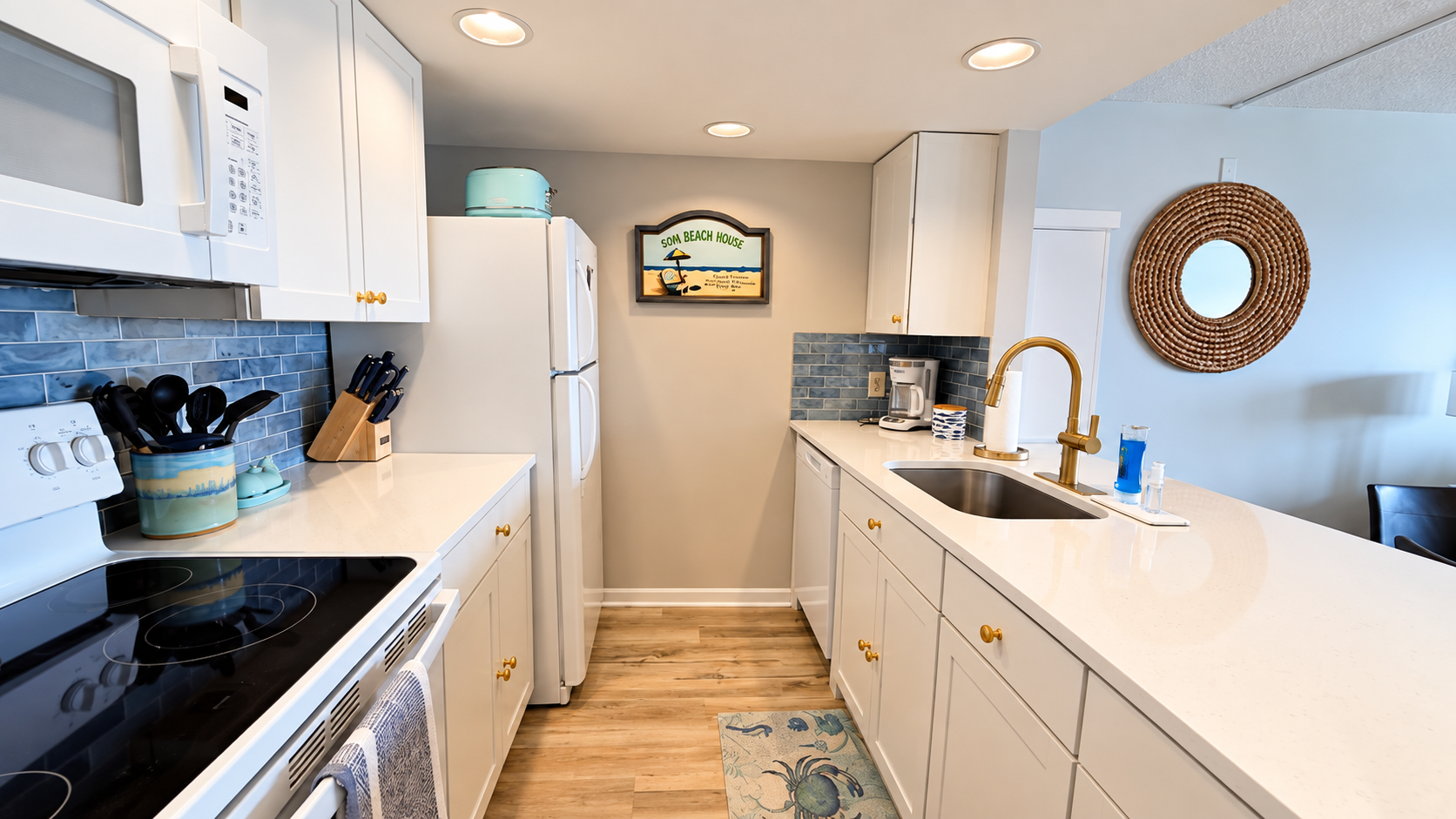 Bright coastal kitchen with sleek counters, stylish finishes, and roomy prep space
