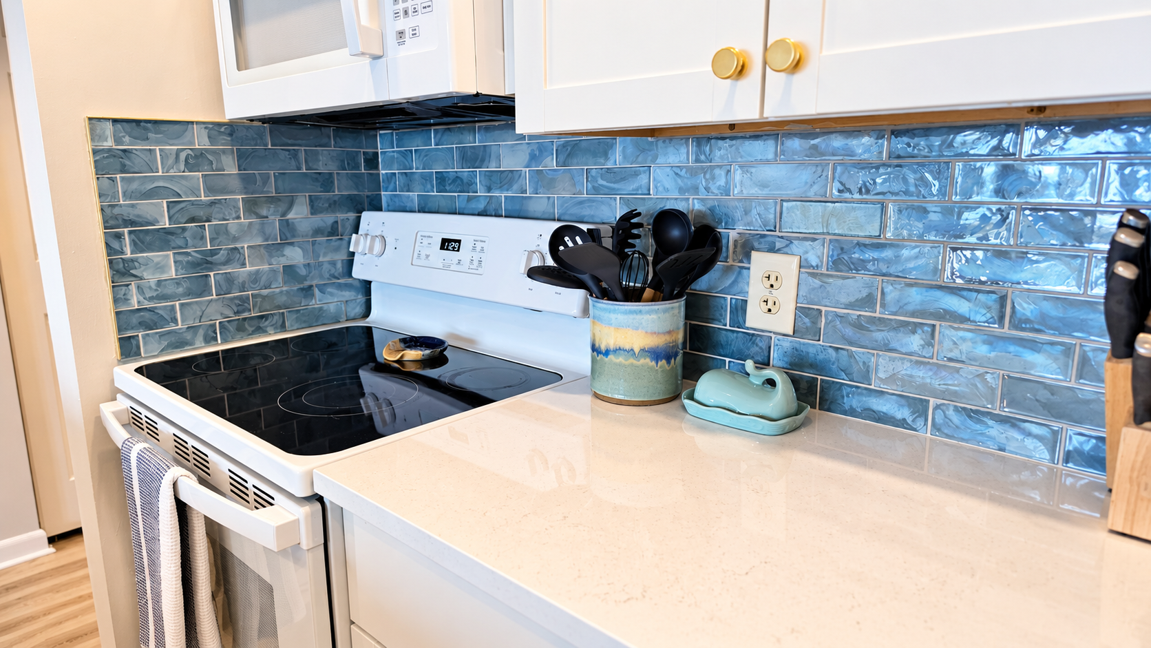 Stylish kitchen with blue tile backsplash and sleek modern finishes