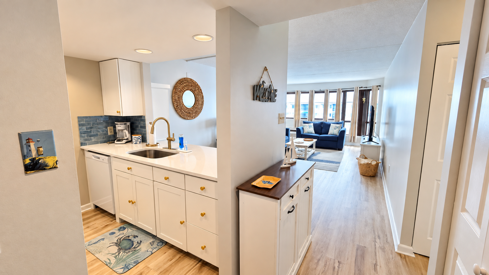 Bright open kitchen and airy living space with stylish coastal touches