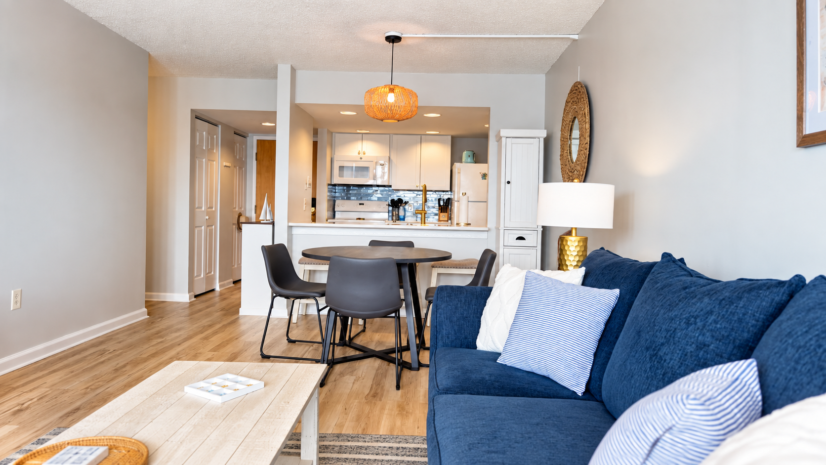 Bright open living area with stylish dining space and full kitchen
