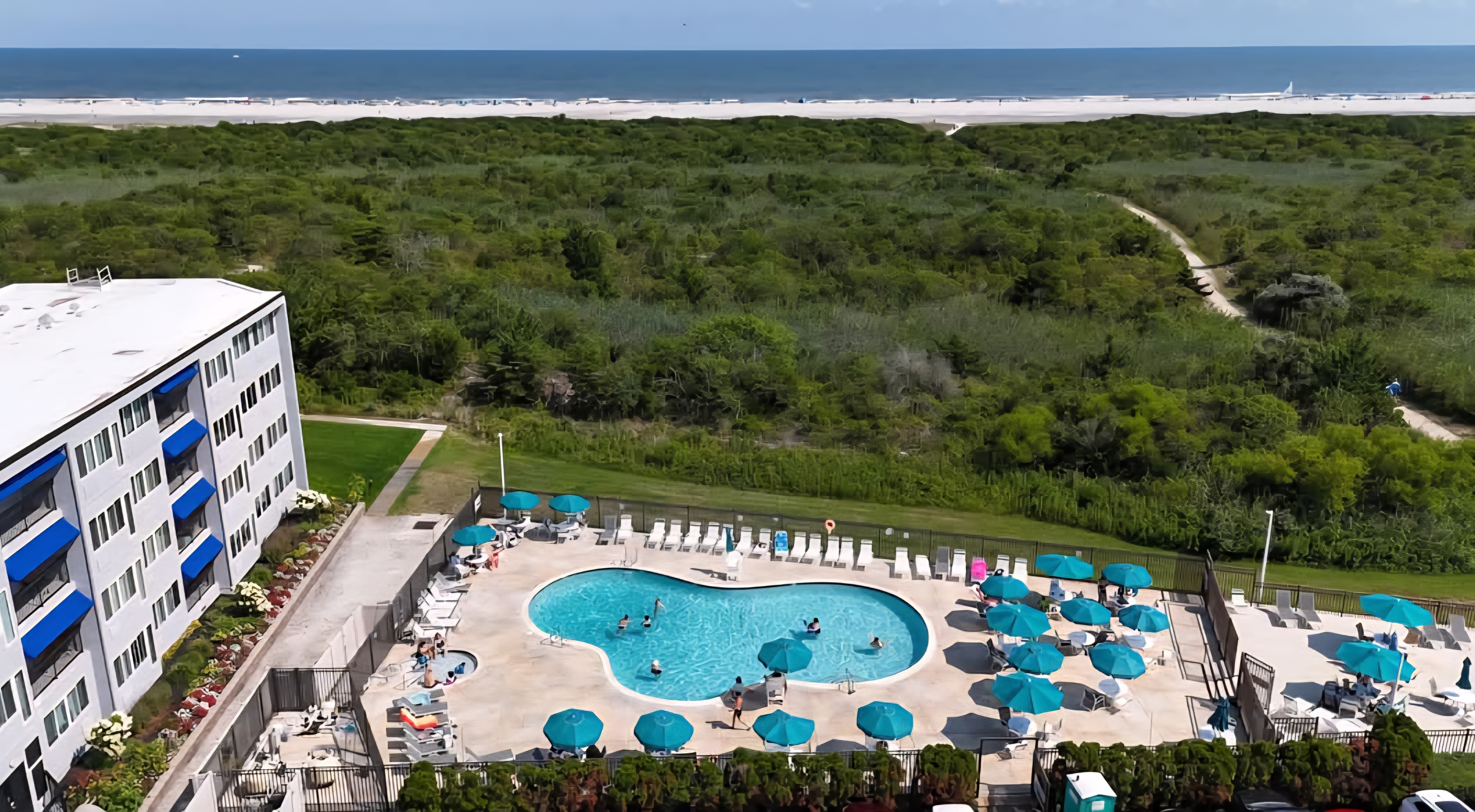 Resort-style pool and beach views just steps from the ocean