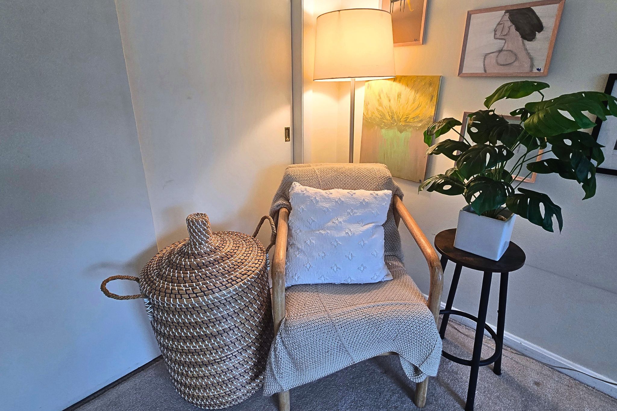 Cozy reading nook with warm lighting, stylish decor, and natural textures