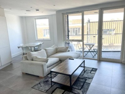 Bright living room opening onto the balcony