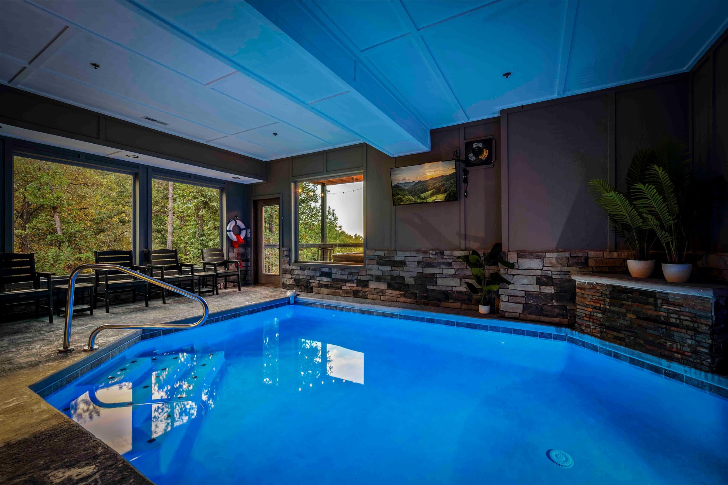 Private indoor pool with serene forest views and a spa-like atmosphere