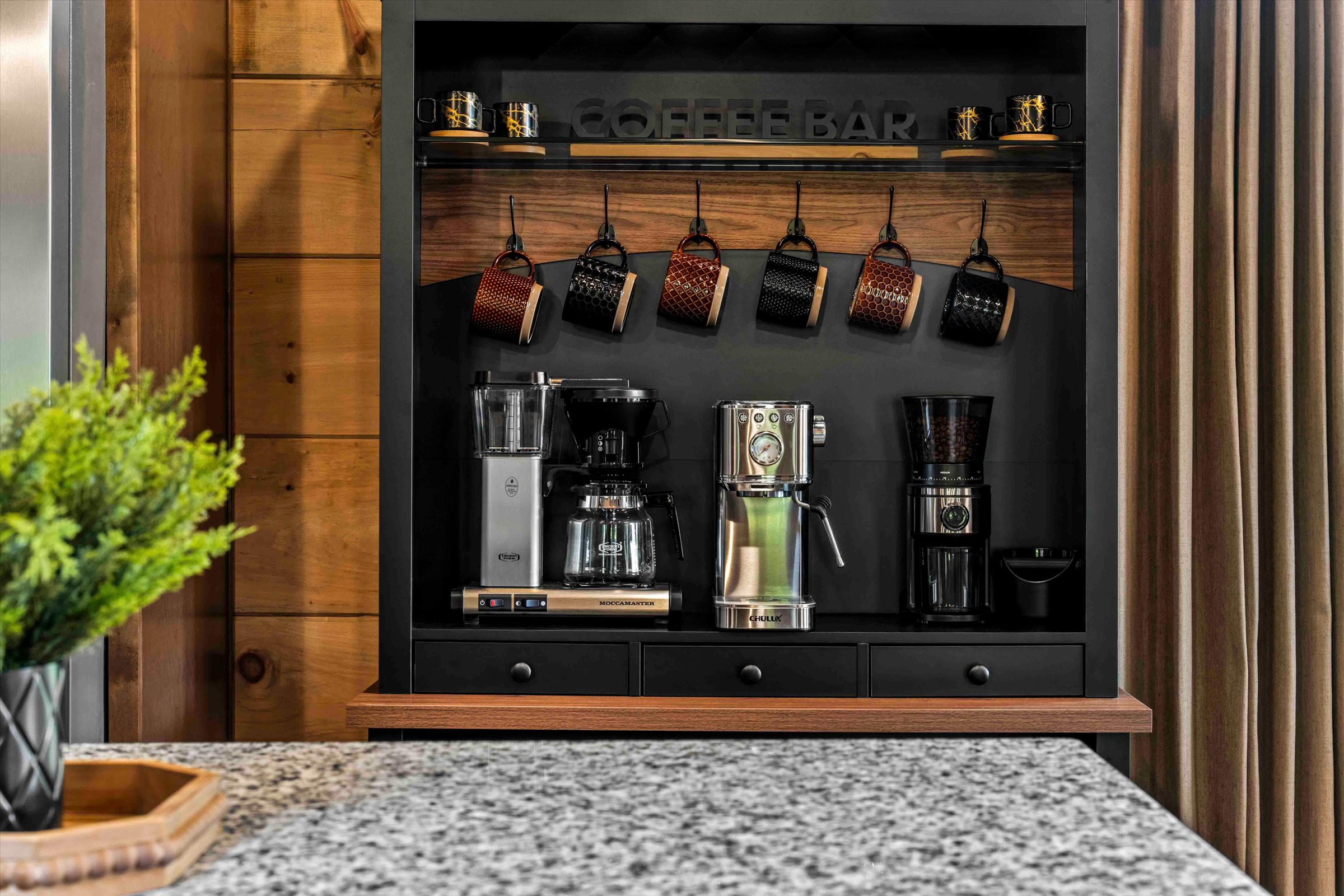 Custom coffee bar with multiple brewers and warm rustic-modern style