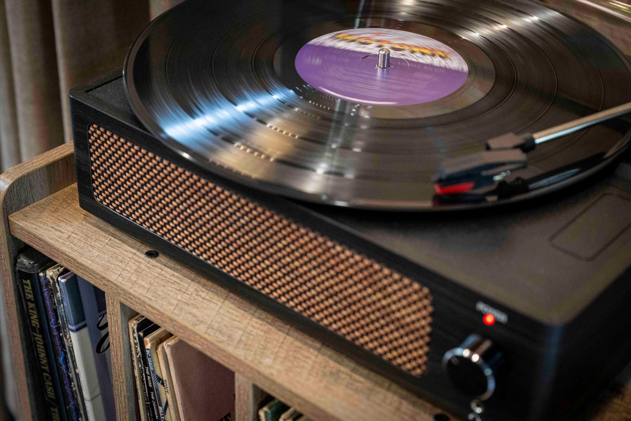Vintage record player setup for a cozy, stylish listening experience