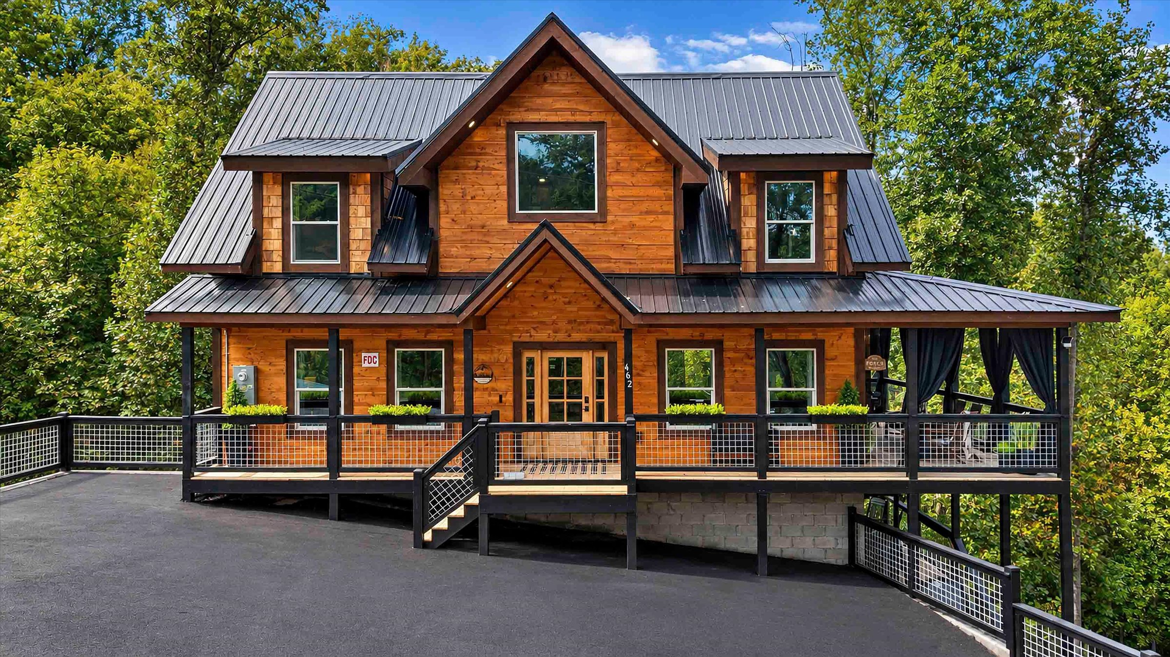 Stunning wood cabin with wraparound deck and peaceful wooded views