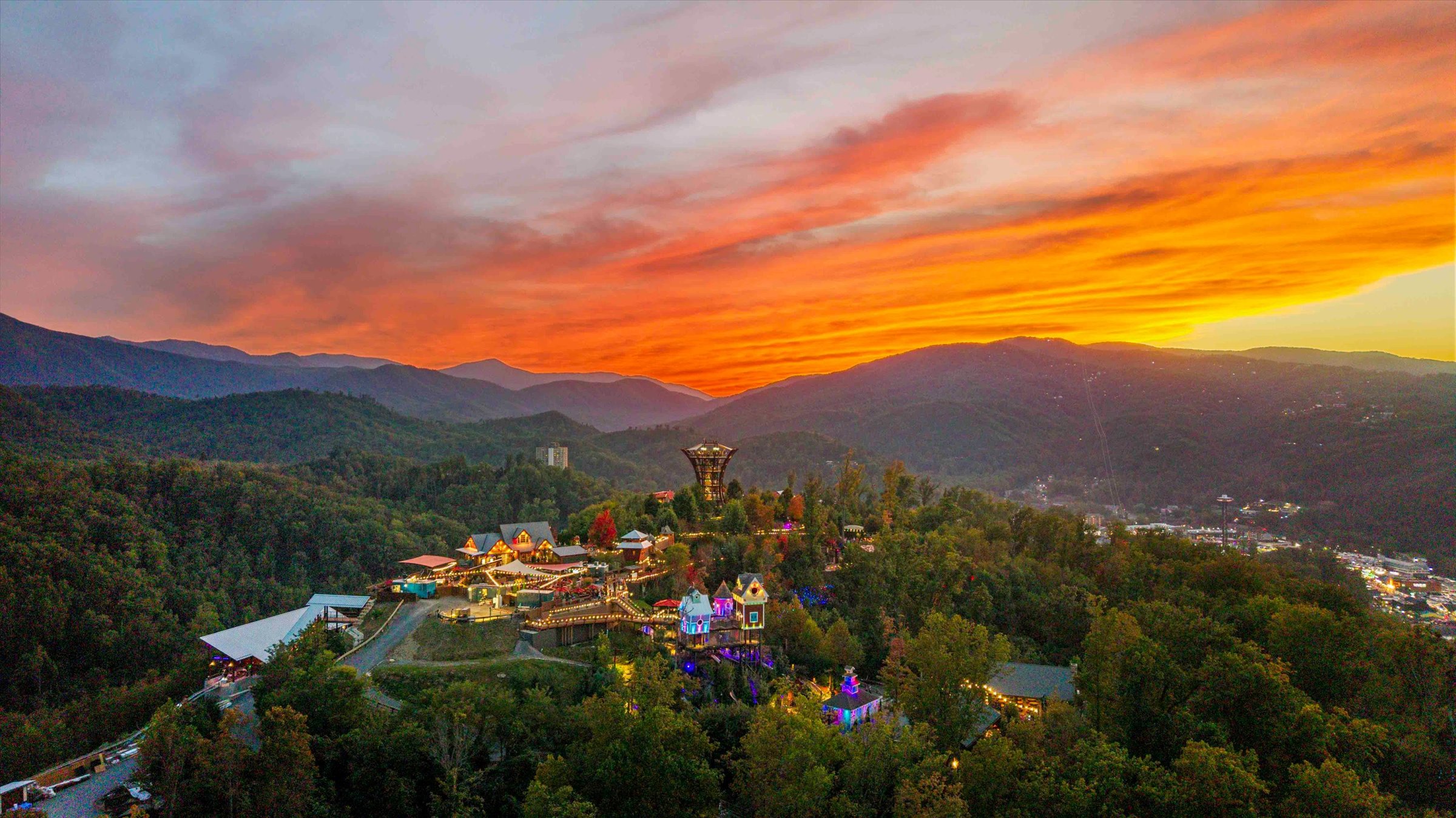 Stunning sunset mountain views over a charming, light-filled hillside retreat