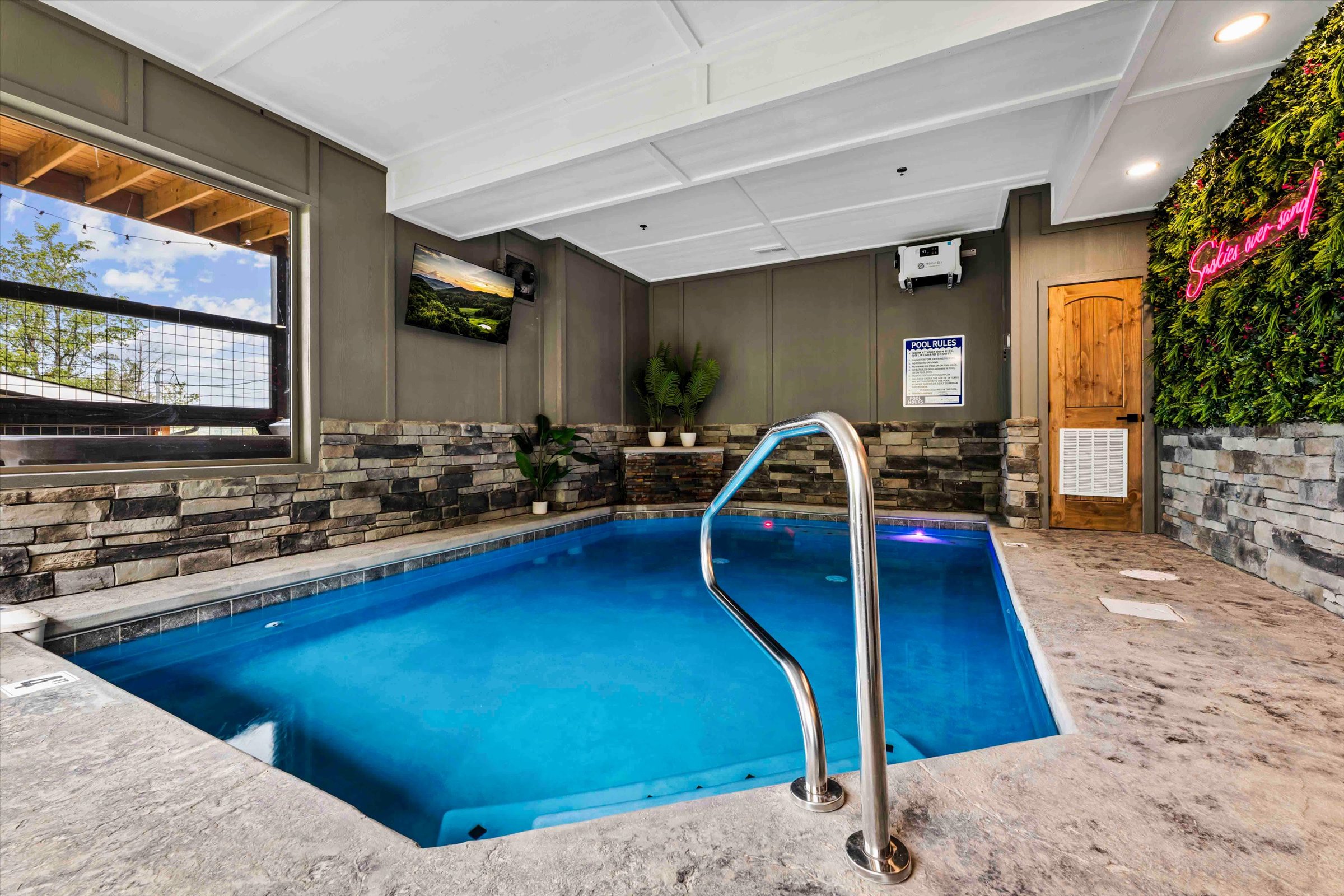 Private indoor plunge pool with stylish stone accents and year-round comfort