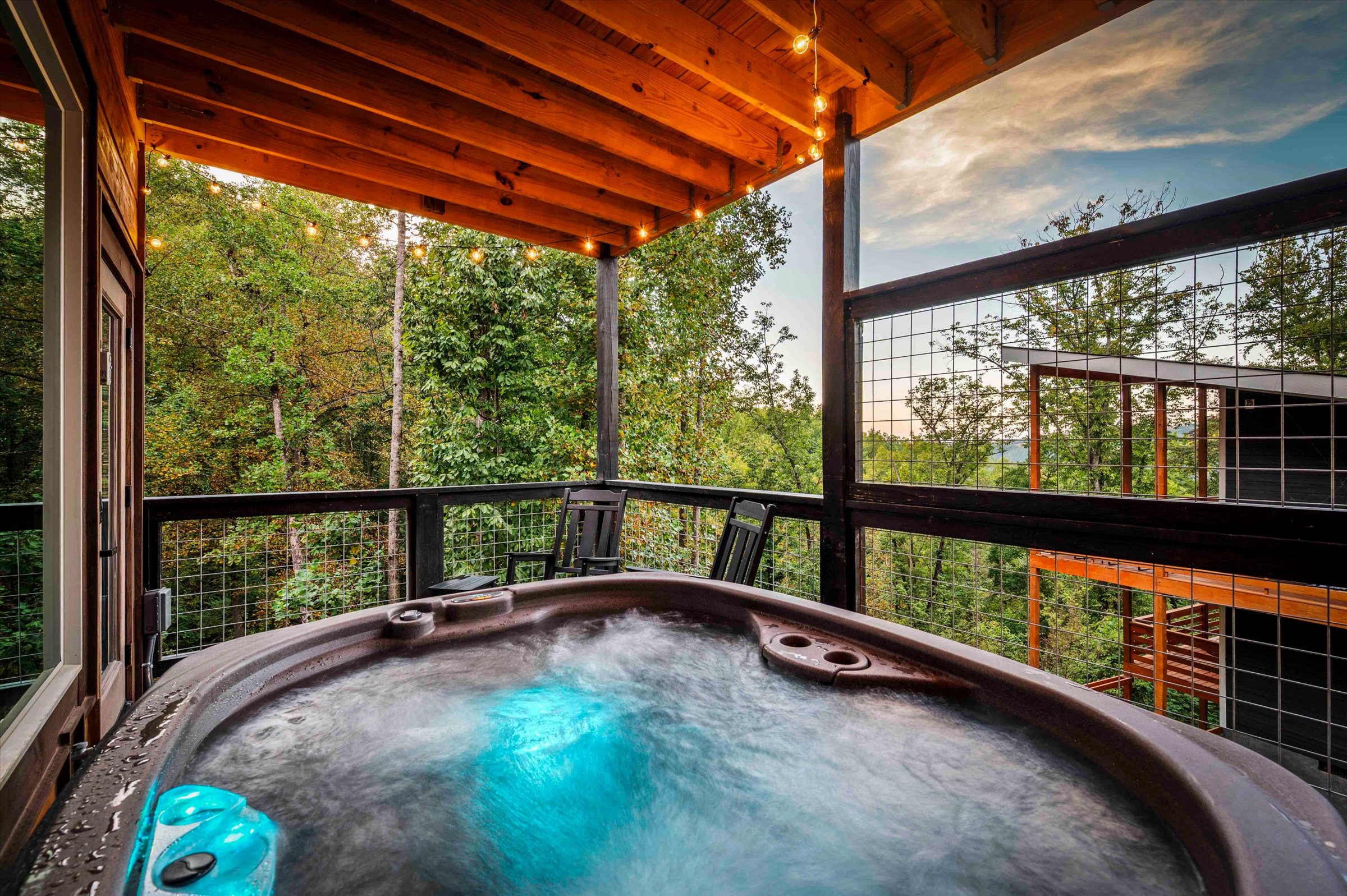 Private covered hot tub deck with peaceful forest views
