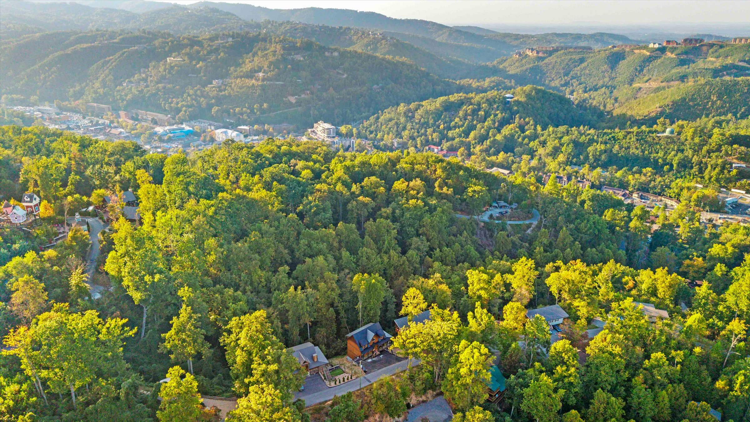 Secluded mountain retreat with lush forest views and golden-hour scenery