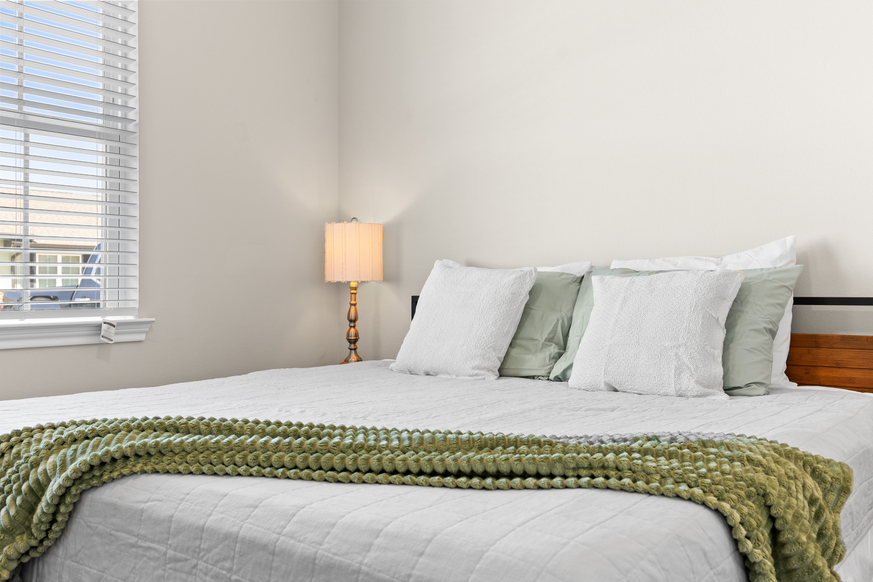 Bright, cozy bedroom with crisp linens and soft natural light