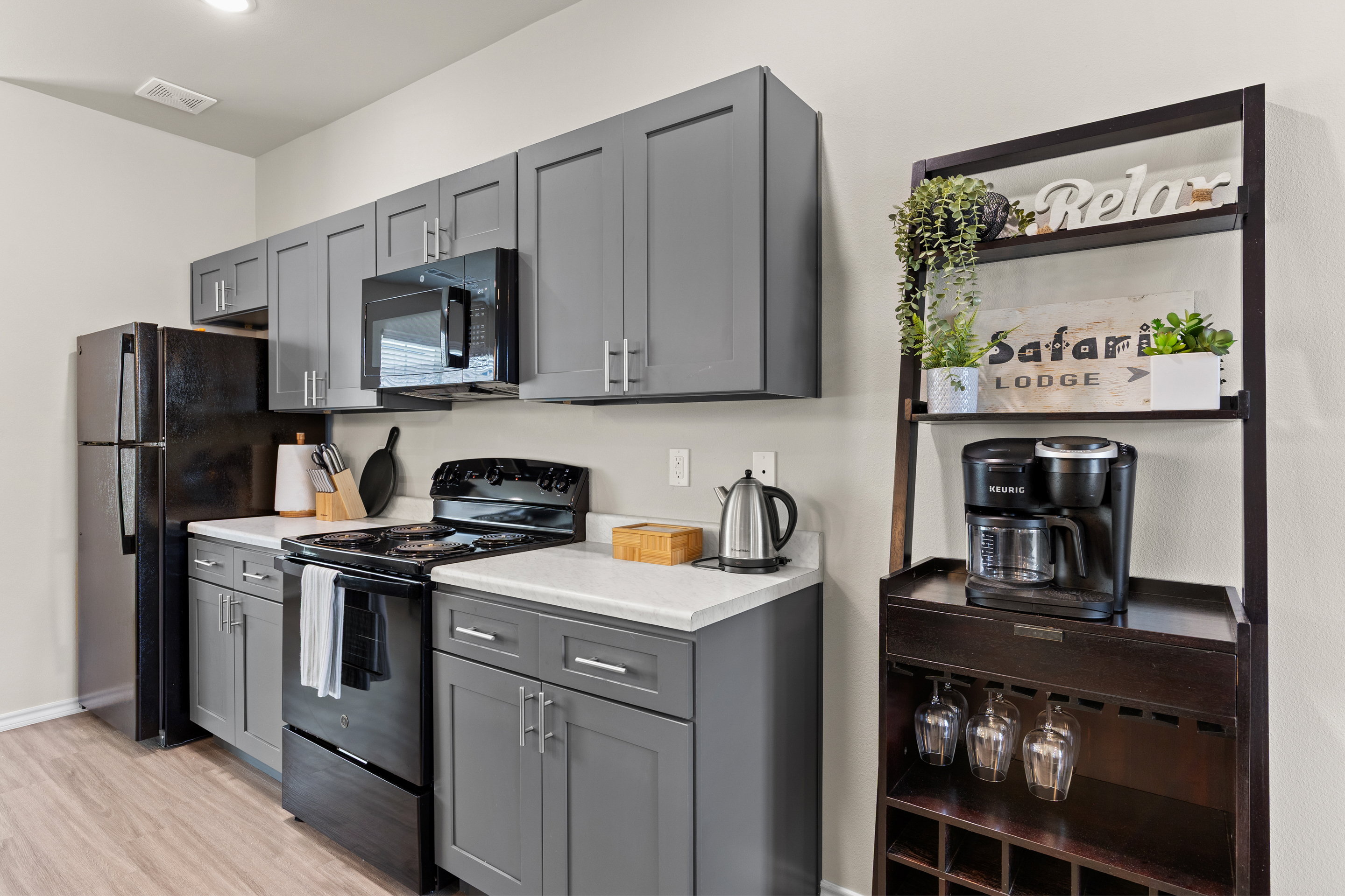 Modern kitchen with coffee bar, sleek finishes, and guest-ready essentials