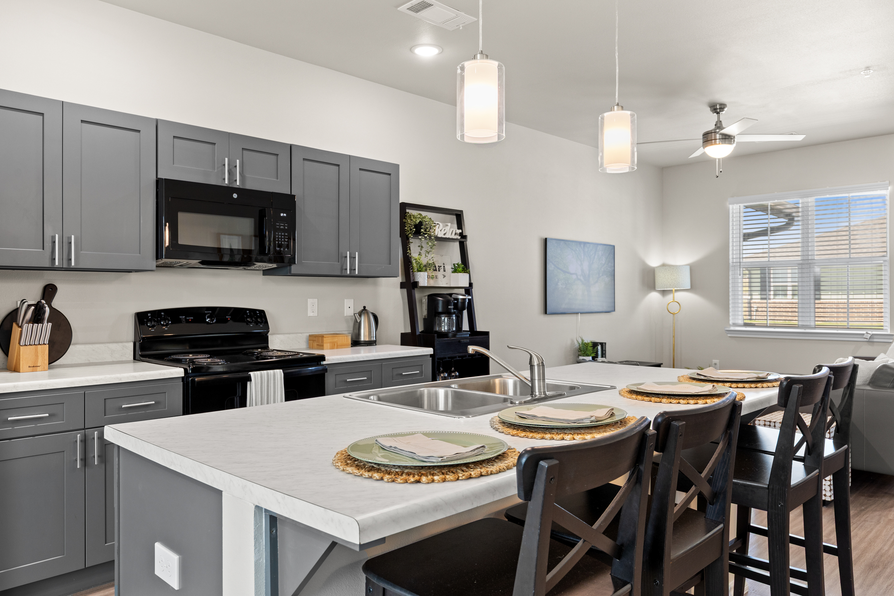 Modern open kitchen with island seating for 4 and stylish finishes