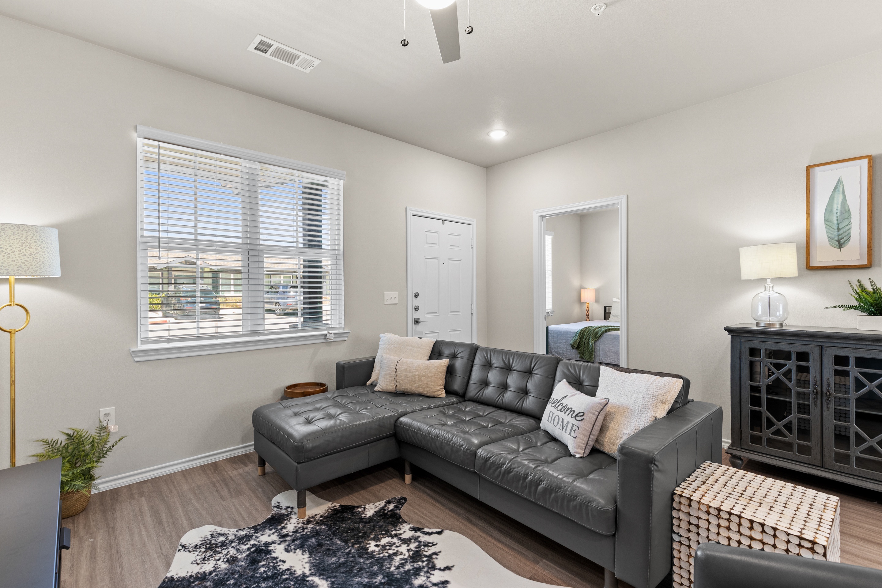 Bright, cozy living room with stylish sectional and natural light