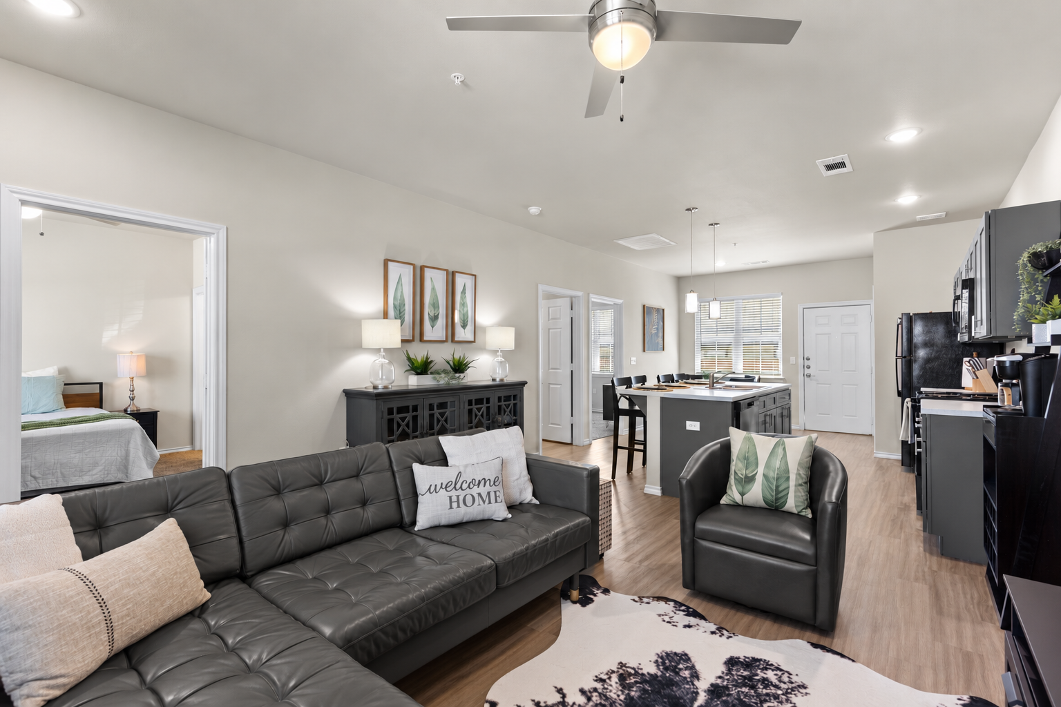 Bright open-concept living space with stylish kitchen and cozy seating