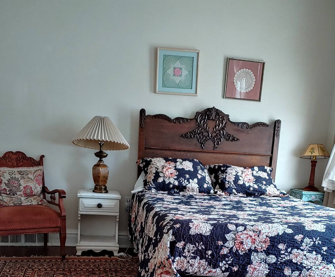 A queen size bed now, in a spacious bedroom.
