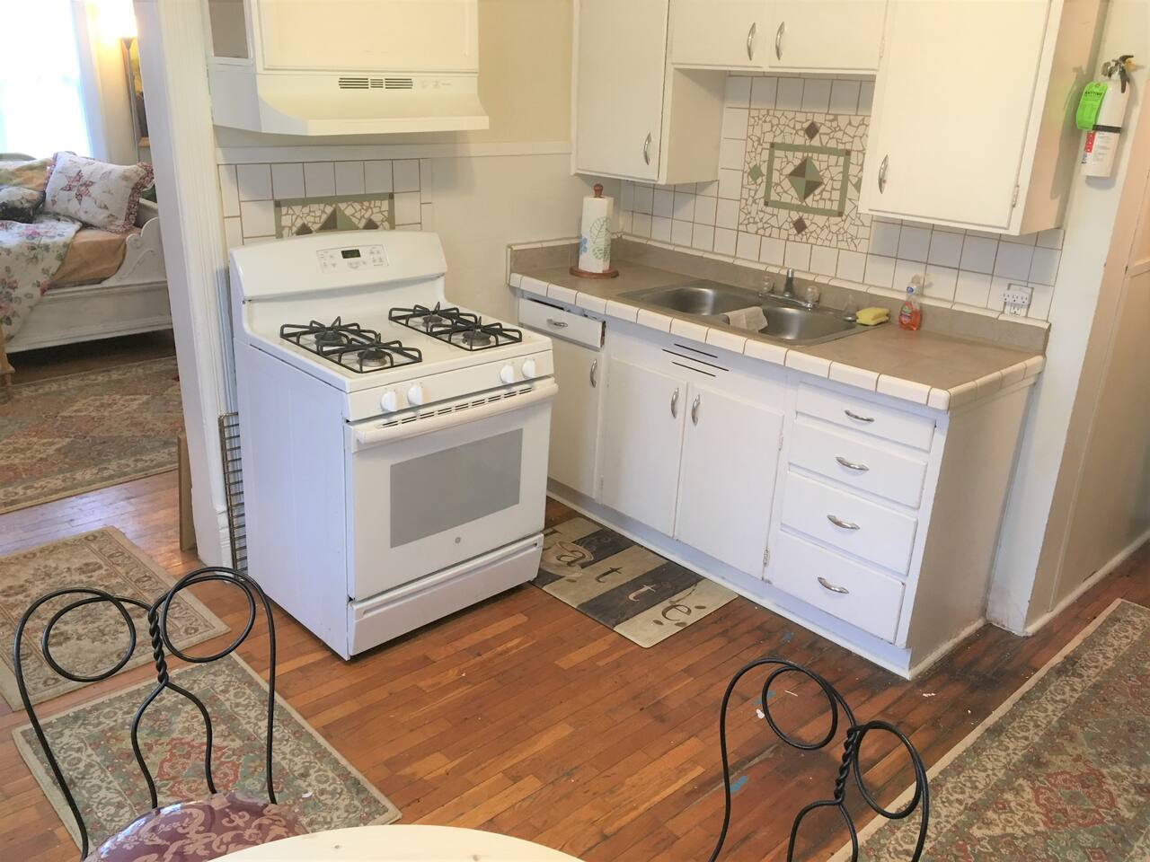 A fully equipped kitchen with refrigerator, gas stove, dishes and silverware to practice your culinary skills