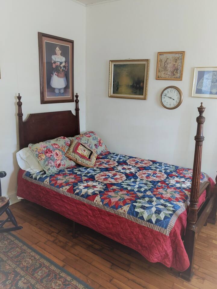 The unique futon is a designed marriage of an old fashioned 4 poster and a modern futon that sleeps two. This photo shows it opened as a double bed.