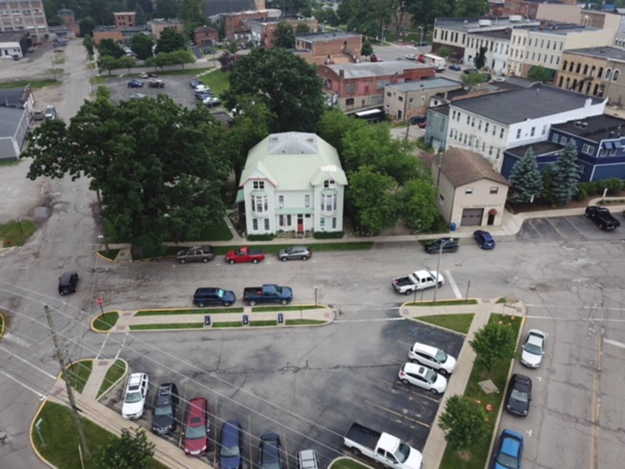 As photographed from above, the Old Fitzpatrick house   sits in  a patch of Greenery in the Heart of Hillsdale! Great Place to relax.