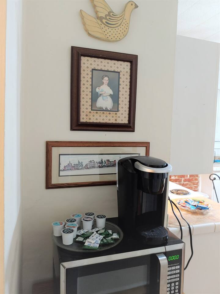 Coffee station with Keurig and snacks nearby