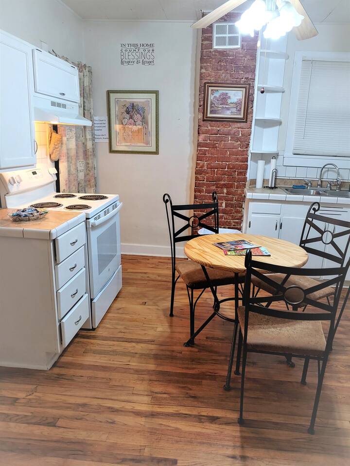 Full size electric range and oven, with nearby counter space.