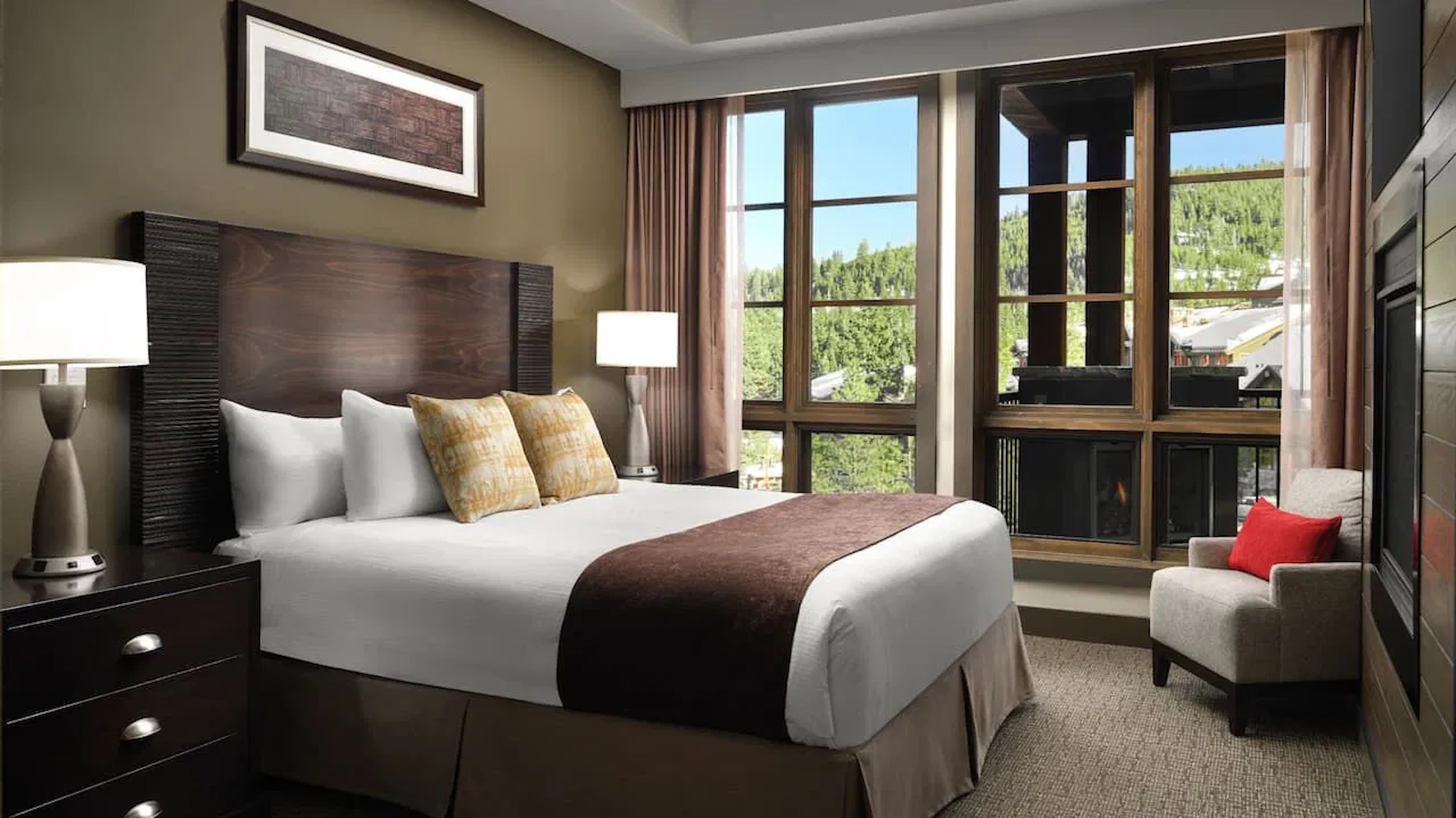 Cozy king bedroom with mountain views and a warm fireplace retreat