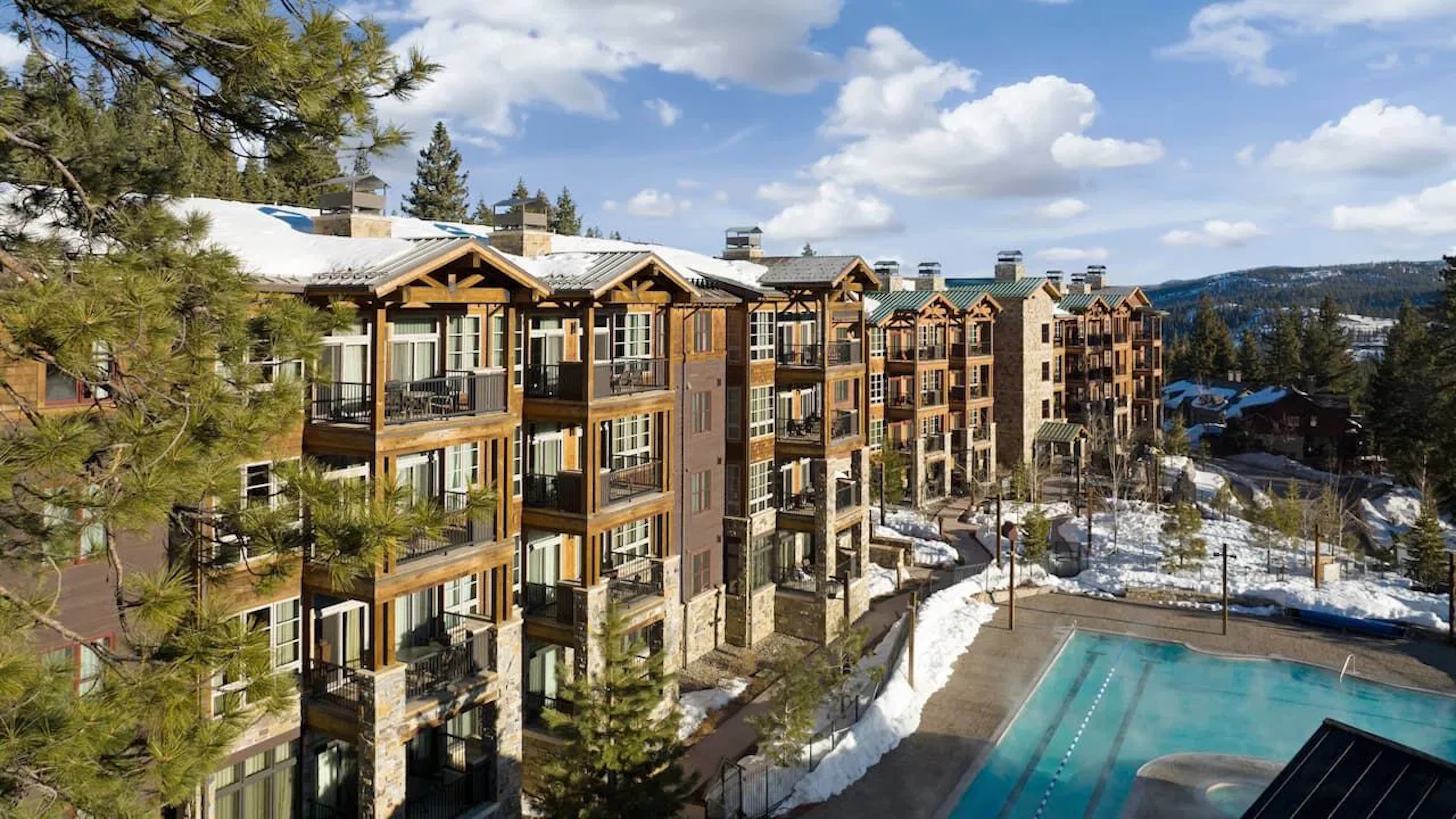 Alpine lodge-style stay with heated outdoor pool and scenic mountain views