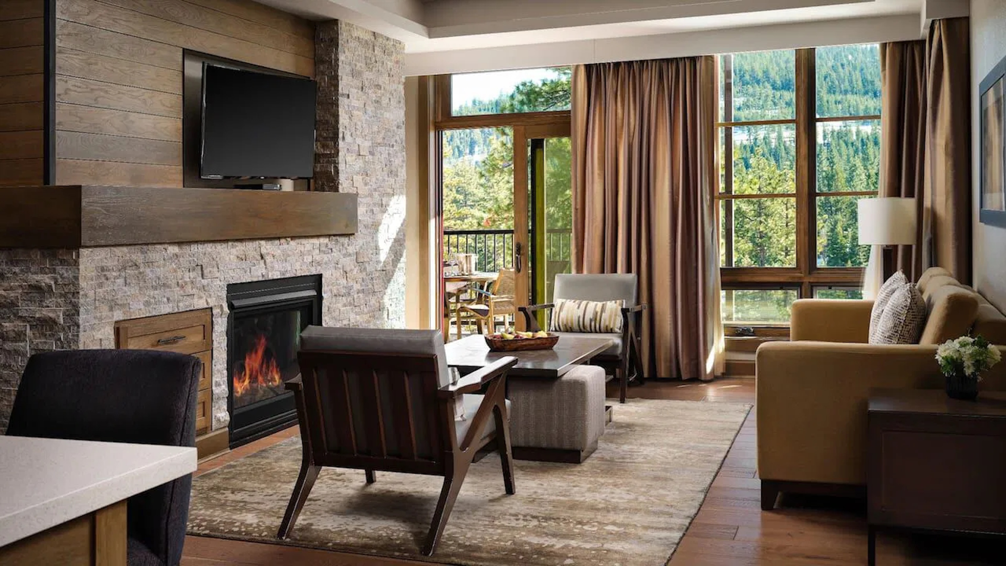 Cozy mountain retreat with fireplace, balcony, and scenic forest views
