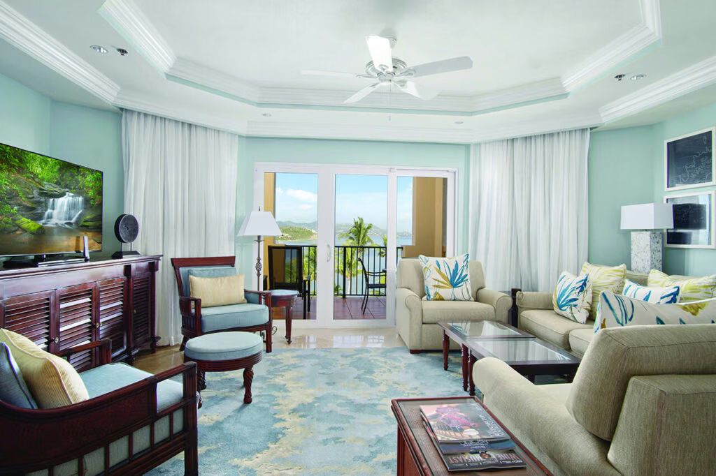 Bright coastal living room with balcony views and plenty of natural light