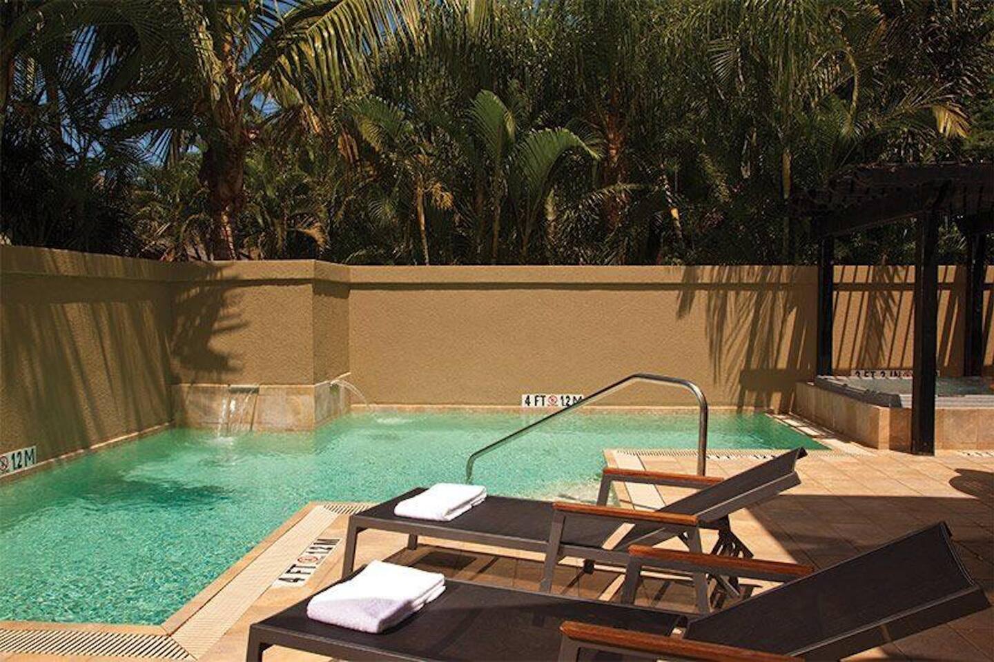 Pool with Loungers and Towels
