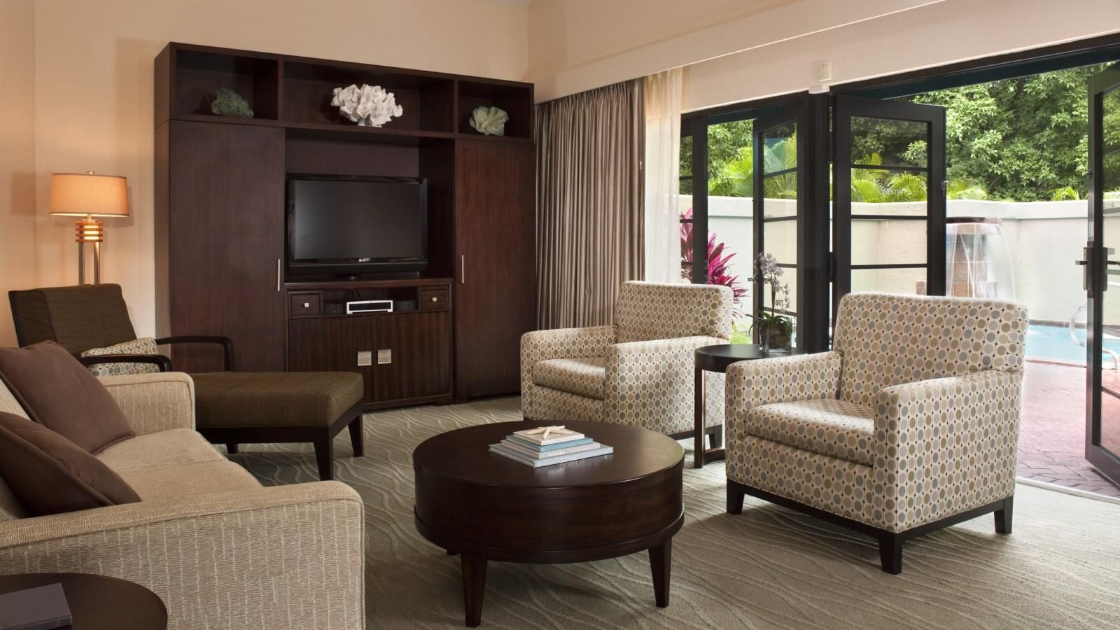 Bright living room with patio access and comfortable lounge seating
