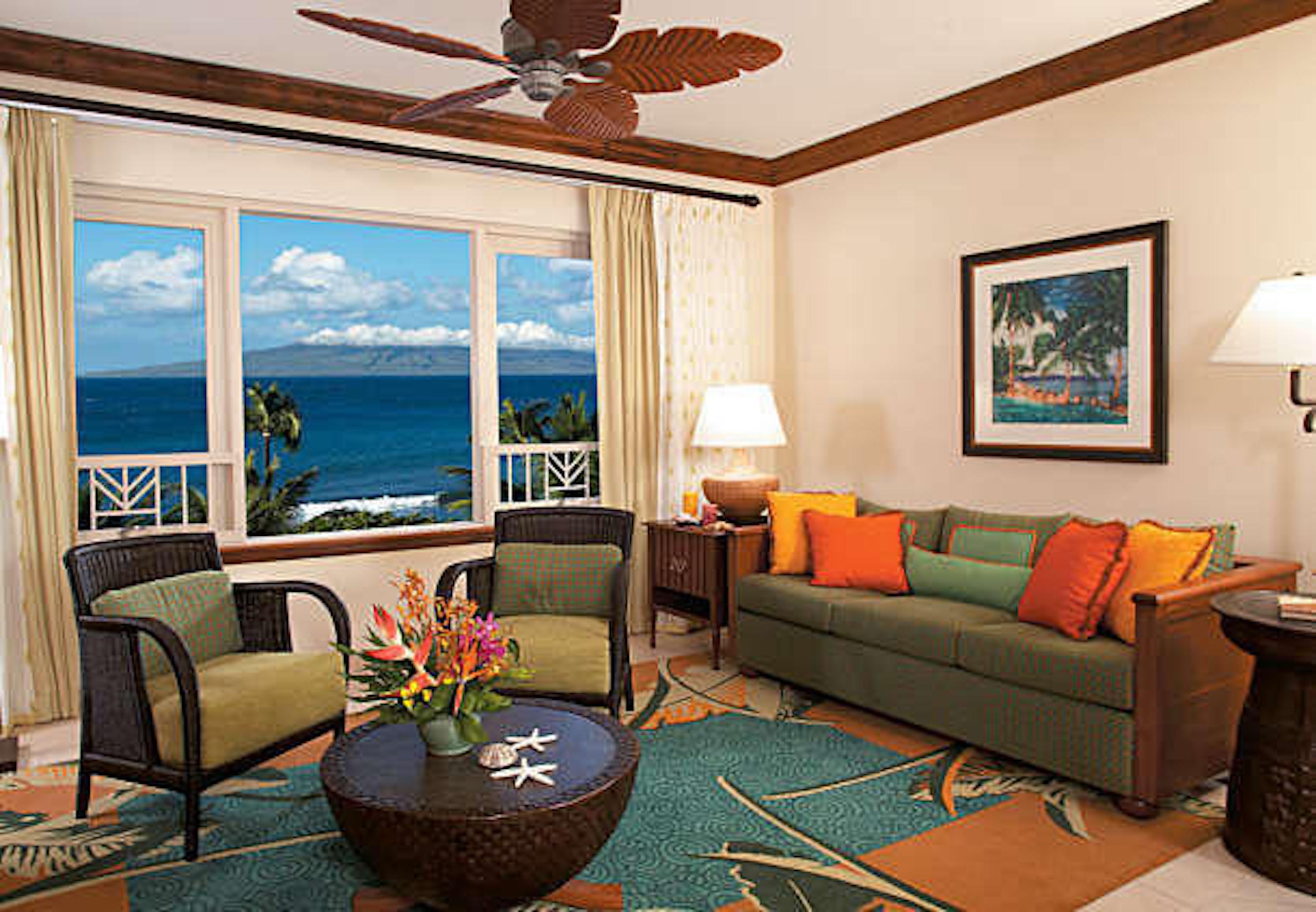 Cozy tropical living room with stunning ocean-view windows