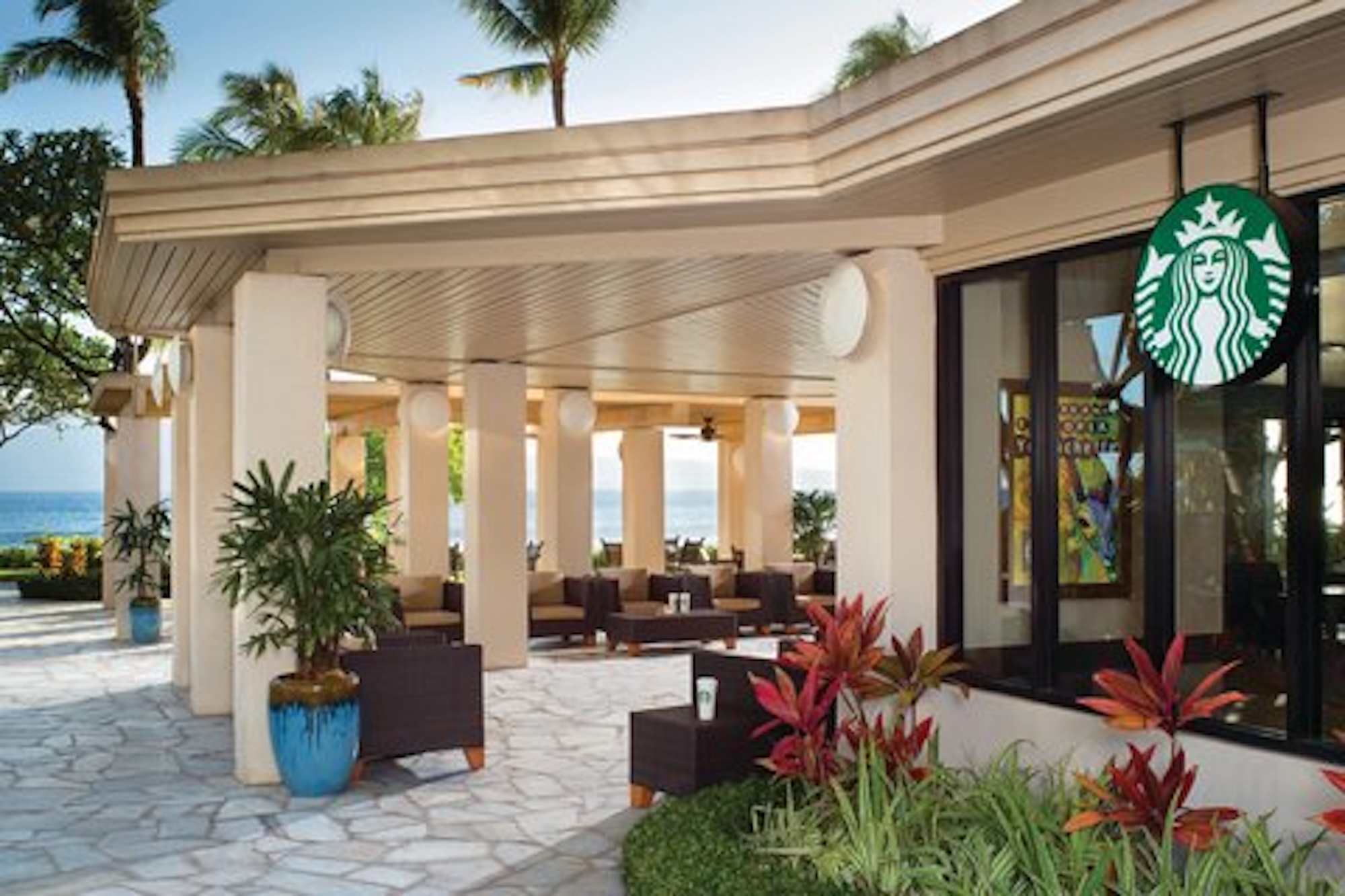 Open-air tropical lounge with ocean views and on-site coffee convenience