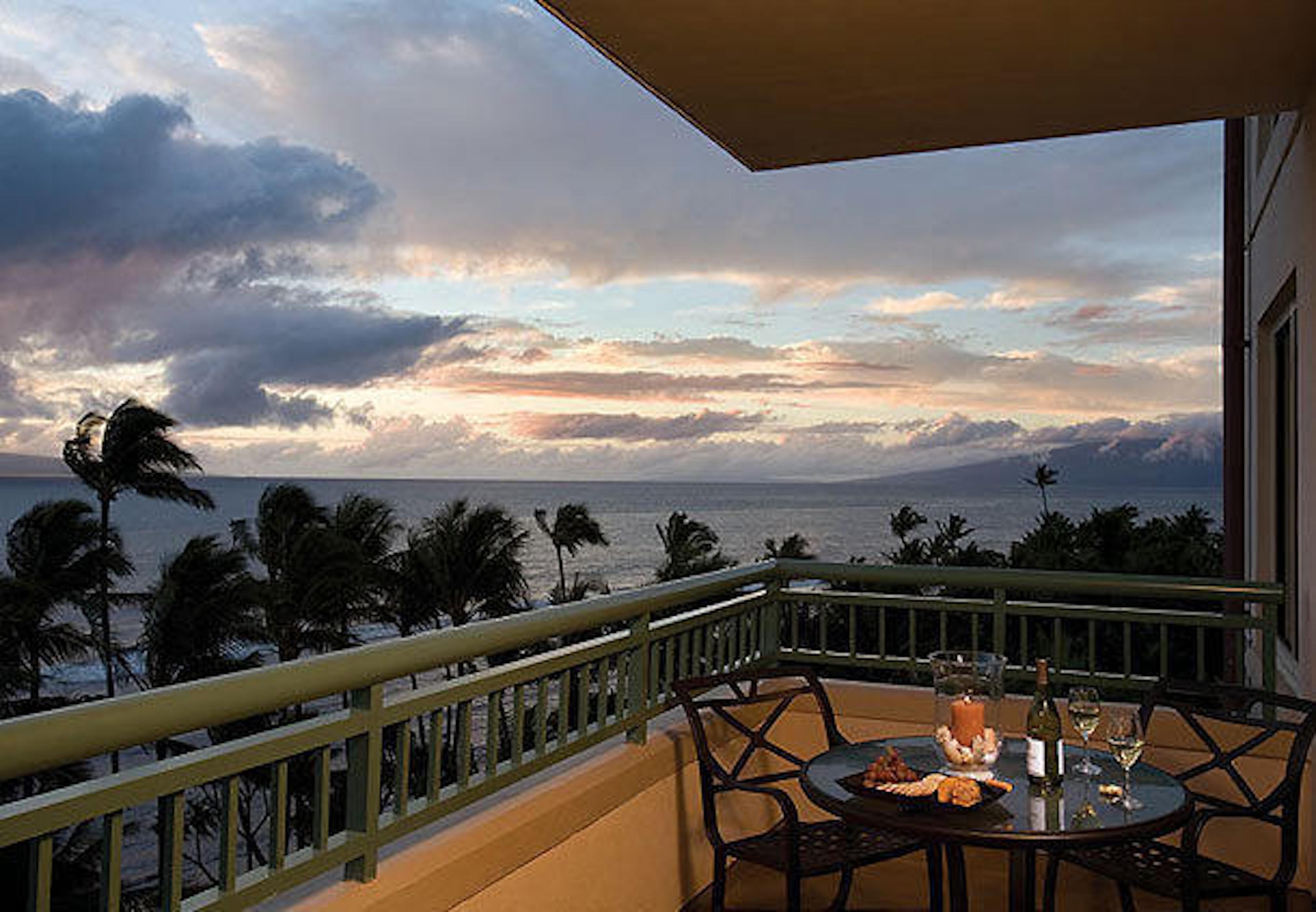 Oceanview lanai with sunset dining and swaying palm tree views