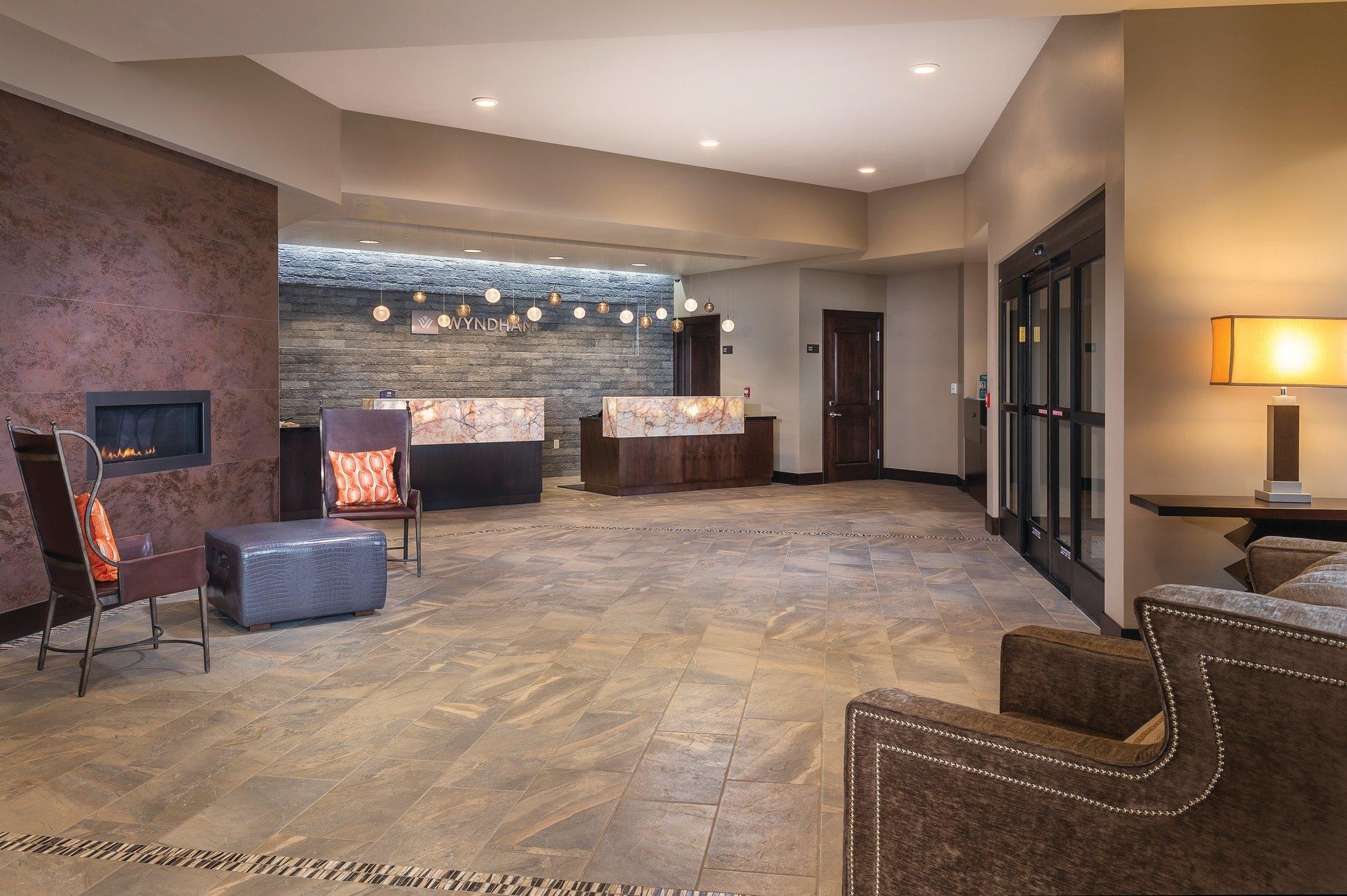 Warm, stylish lobby with fireplace and upscale welcome area