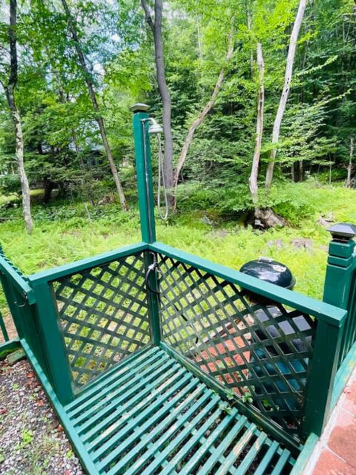 Private wooded deck with grill for peaceful outdoor dining