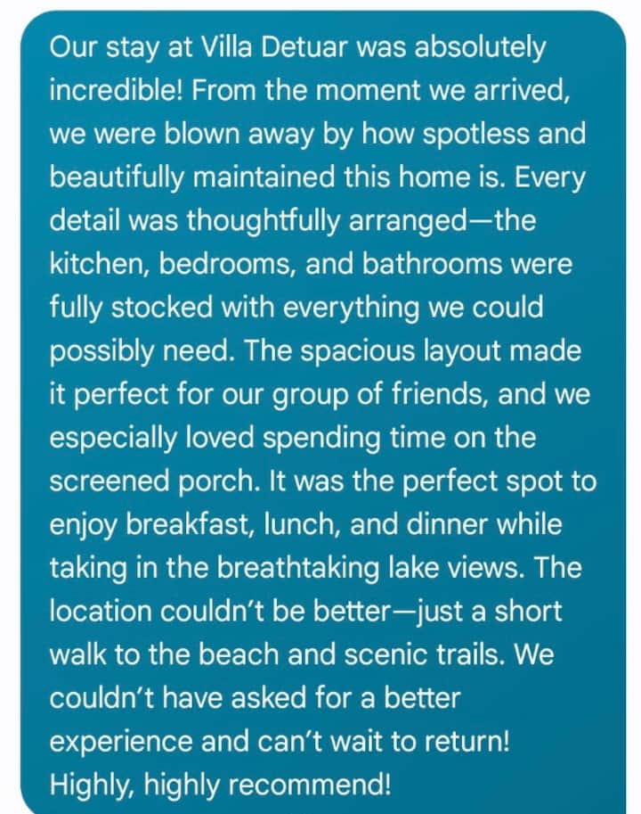 5-star guest review praising lake views, location, and spacious comfort