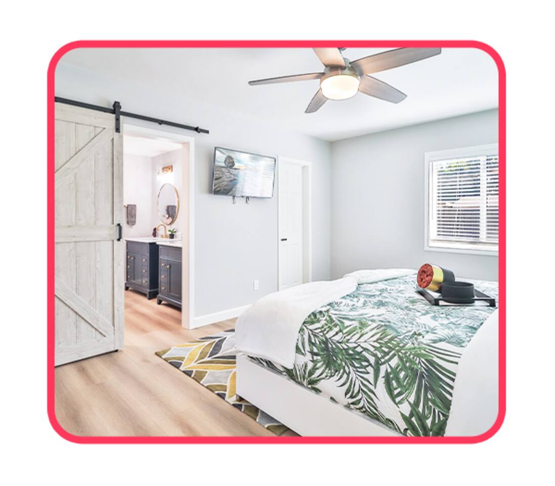 Modern Bedroom with Ensuite Bath, TV & Natural Light – Designed for Comfort & Convenience