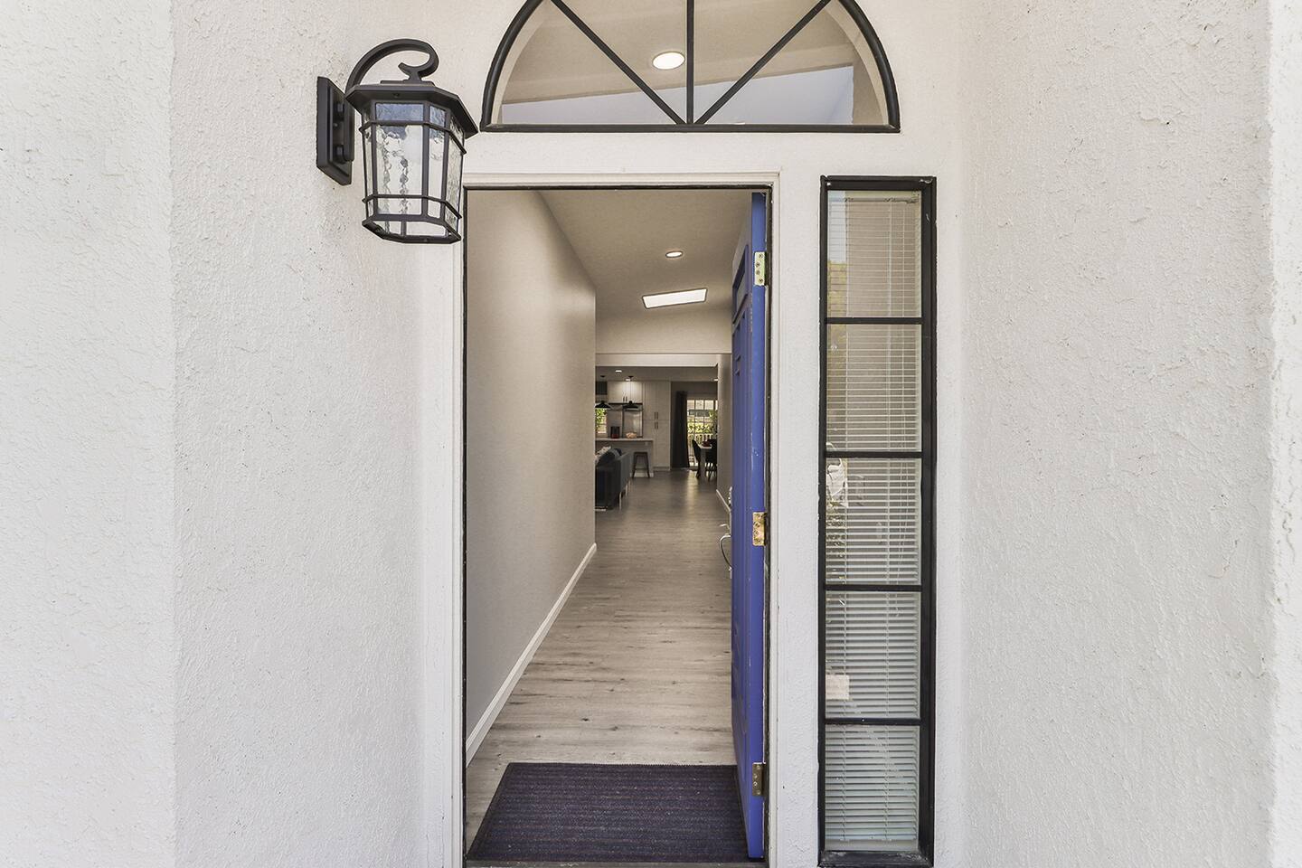Modern front entrance with lantern light