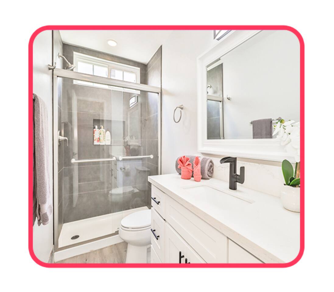Modern bathroom with glass shower and orchid decor