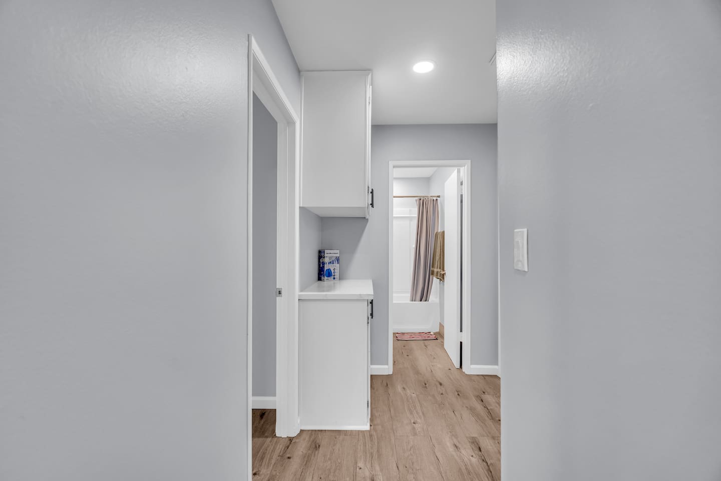 Bright hallway with built-in storage and modern finishes
