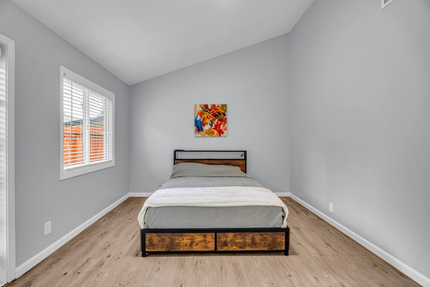 Spacious, modern bedroom with clean design.