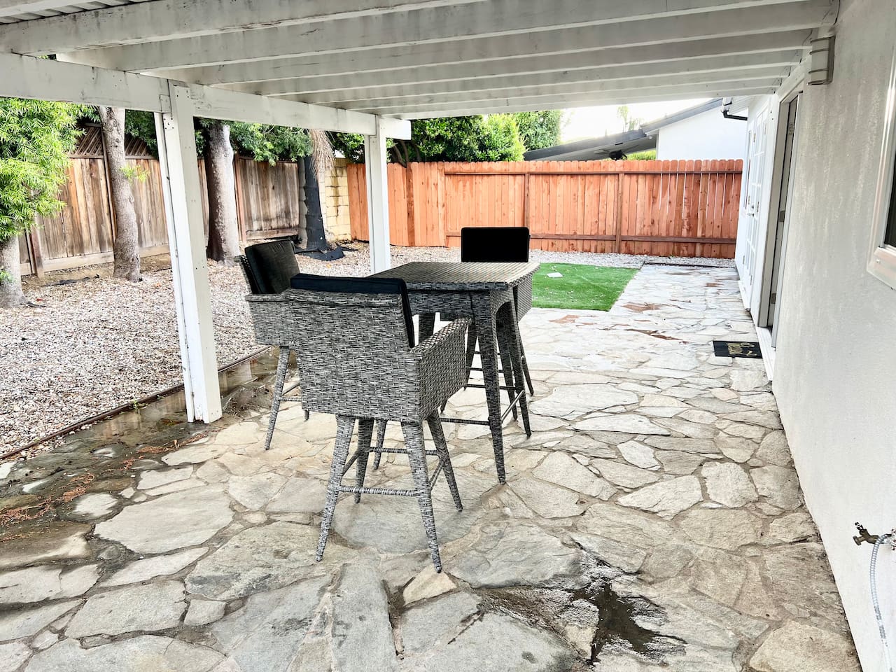 Outdoor lounge with pergola and modern seating.