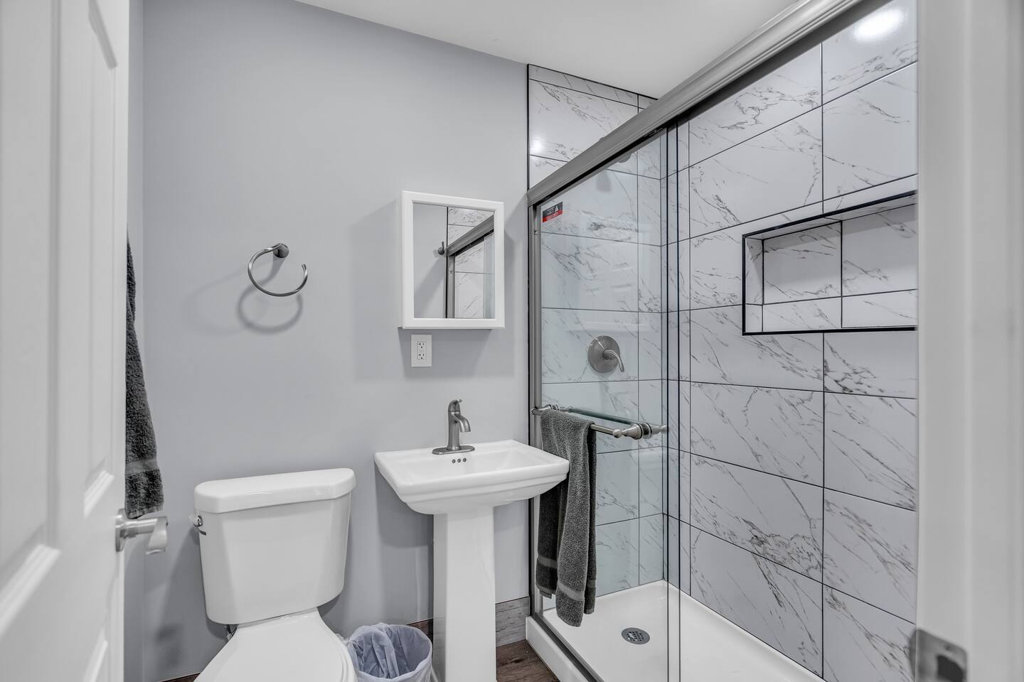 Modern bathroom with marble-style shower