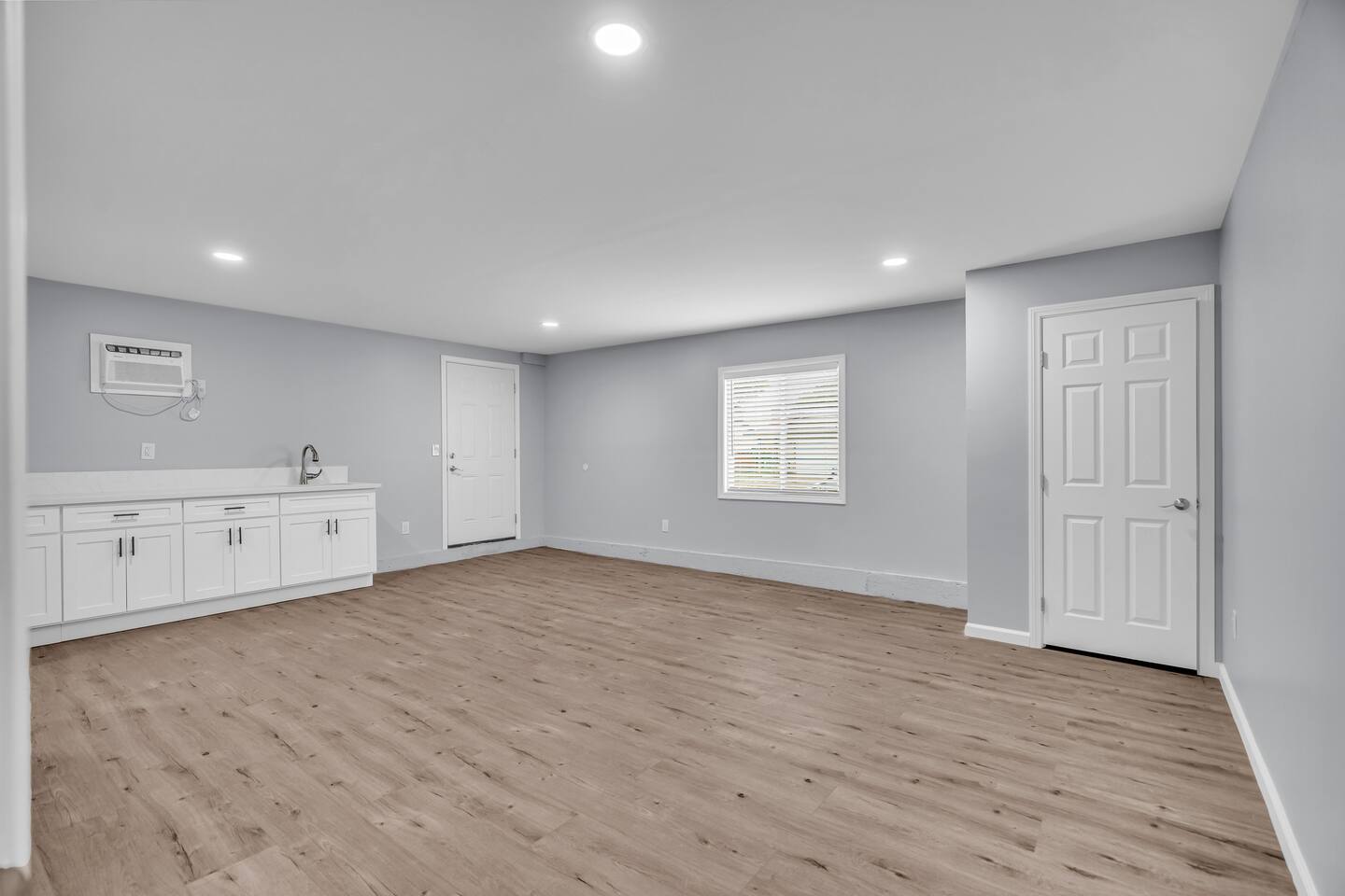 Minimalist guest room with private entry and natural light