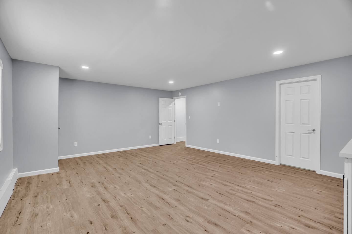 Bright, modern room with recessed lighting.