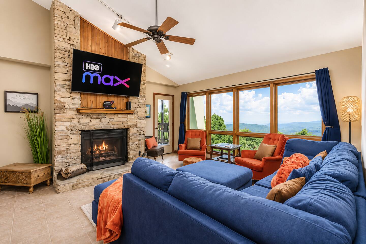 Gather the family in this spacious mountain living room featuring cozy fireside seating, a large Smart TV, and incredible panoramic Smoky Mountain views. The perfect spot for movie nights, games, and relaxing together after a day in Gatlinburg!
