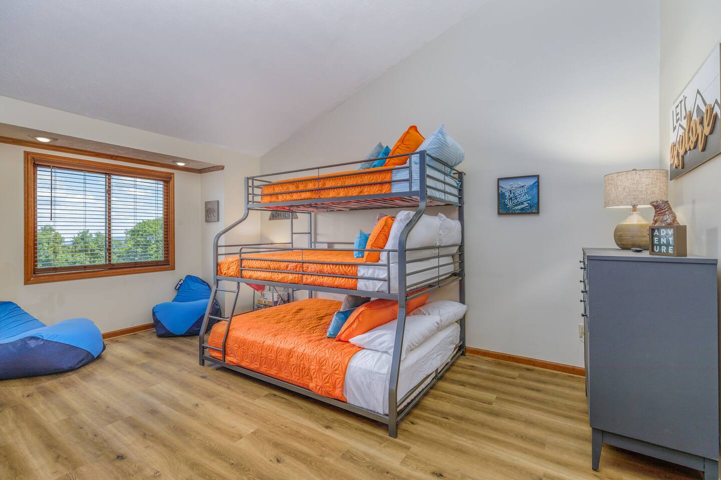 The kids will love having their own fun retreat! This spacious bunk room offers plenty of sleeping space, colorful mountain-inspired décor, and comfy bean bags—perfect for siblings and cousins to relax after a day of Smoky Mountain adventures.
